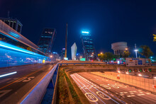 Long Exposure Of Blue Traffic Light Trails At Night Against Dark Sky In Madrid