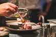 © Luis Gomez/ADDICTIVE STOCK - Chefs preparing beautiful dishes in French restaurant's kitchen
