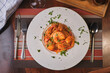 © Luis Gomez/ADDICTIVE STOCK - Beautiful dish of spaghetti  with prawns on wooden table.