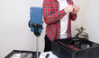 © deine_liebe - A computer repairman records a video for his blog. The guy disassembles the computer in an online broadcast