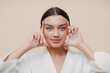 © primipil - Young woman doing face building facial gymnastics self massage and rejuvenating exercises
