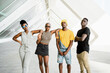 © Rafa Cortes/ADDICTIVE STOCK - Group of cheerful African American stylish people standing together on the street looking at camera