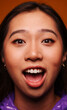 © Victor Torres/ADDICTIVE STOCK - Close-up portrait of cheerful Asian young woman