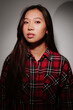© Victor Torres/ADDICTIVE STOCK - Close-up portrait of cheerful Asian young woman with serious face