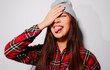 © Victor Torres/ADDICTIVE STOCK - Close-up portrait of cheerful Asian young woman covering her face with her hand and sticking out her tongue
