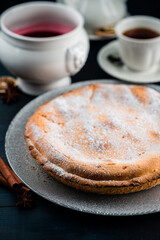 Poster - pie with cottage cheese and icing sugar on wooden background, cottage cheese pie