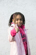© mina92 - Portrait of a little mixed girl showing thumb up