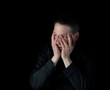 © tab62 - Depressed mature man holding his face with both hands while showing emotion of stress