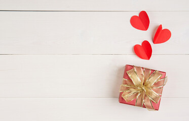 Canvas Print - Gift box and heart shape paper on wooden table background, love and romance, presents in celebration and anniversary with surprise on desk, happy birthday, donate and charity, valentine day concept.