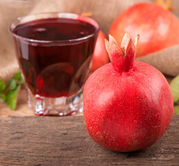 Sticker - ripe pomegranate with leaves on a wooden board