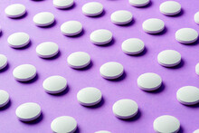 Image Of Medicine, Drugs, Pills. Placed On The Surface Layer Of Purple.