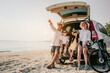 © Garun Studios - Happy asian family enjoying beach trip with their favorite car. Parents and children are traveling the way to the sea.Holiday and travel family concept, Summer vacations.