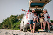 © Garun Studios - Happy asian family enjoying road trip with their favorite car. Parents and children are traveling the way to the sea or ocean.Holiday and travel family concept, Summer vacations.