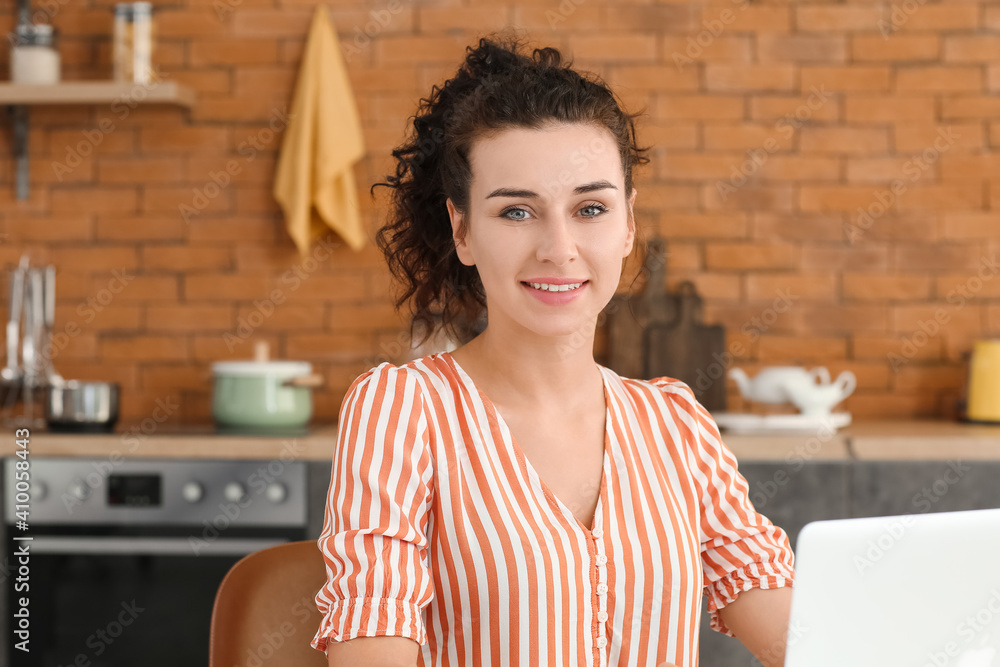 Young woman in kitchen at home