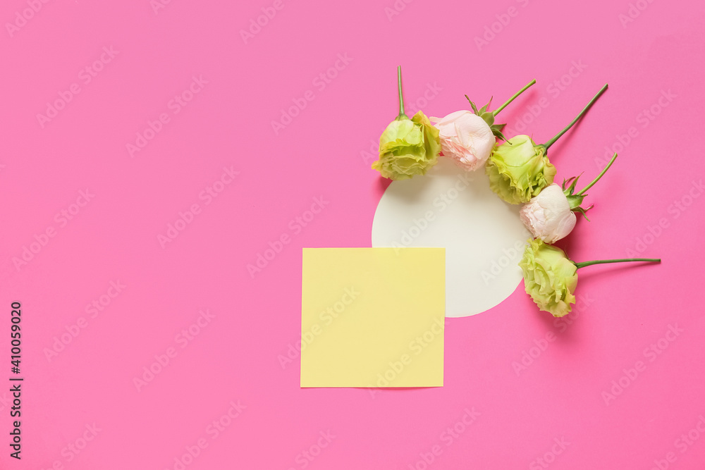 Beautiful flowers and blank cards on color background