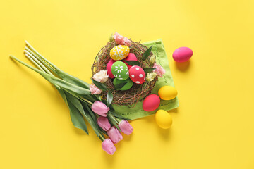 Wall Mural - Composition with beautiful Easter eggs and flowers on color background