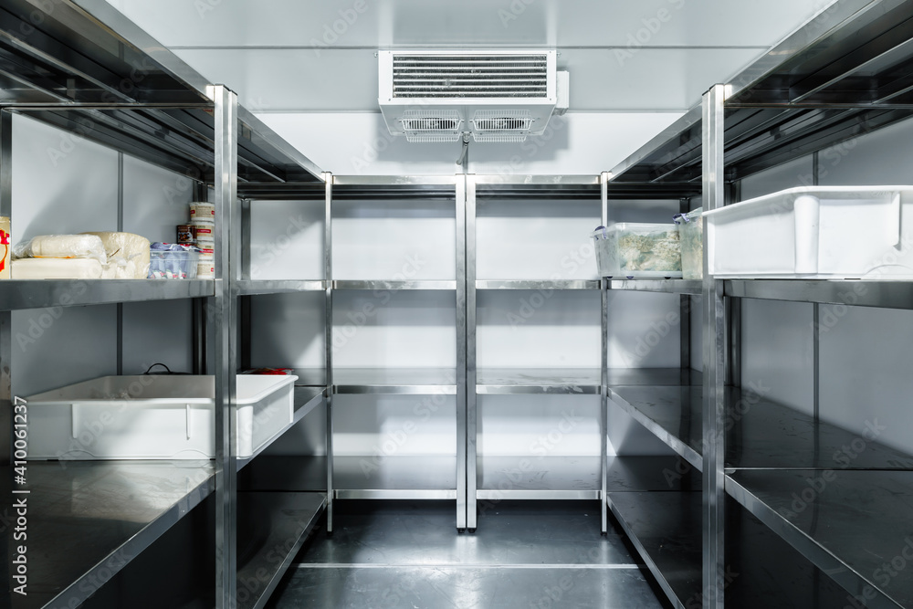 Refrigerator chamber with steel shelves in a restaurant - obrazy, fototapety, plakaty 