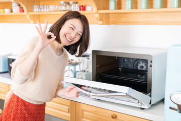 Canvas Print - 料理をする女性　オーブン