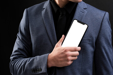 Poster - Businessman in suit showcasing futuristic mobile phone technology