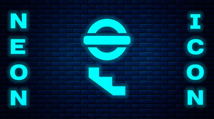 Sticker - Glowing neon London underground icon isolated on brick wall background. Vector.