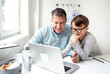 © epiximages - Online shopping concept. Dad and son using laptop for online shopping during corona crisis.