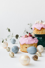 Wall Mural - Glazed easter cake decorated with flowers on textured background. Happy Easter