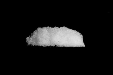 Wall Mural - heap of white snow isolated on a black background