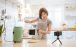 © paulaphoto - Portrait of beauty asian woman review cooking fry potato food , recording live video using air flyer smart home device. Online influencer sme girl on social media marketing, hobby and leisure concept