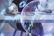 © peshkova - Double exposure of businesswoman hands typing on computer and forex chart hologram drawing. Financial analysis concept.