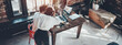 Office business teamwork concept. Two teammates have video call with remote working managers. Wide screen