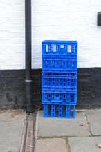 Stack Of Blue Plastic Crates In Close Up On Street