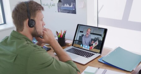 Poster - Caucasian man using laptop and phone headset on video call with male colleague