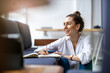 © pikselstock - Young female freelancer working in loft office