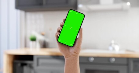 Wall Mural - smartphone blank screen in hand, angled position, the phone turns on after shaking