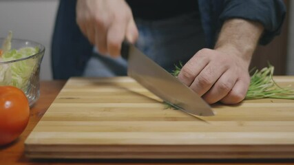 Canvas Print - Chef chopping up dill on a wooden board