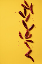Dry Chili Pepper Over Yellow Background