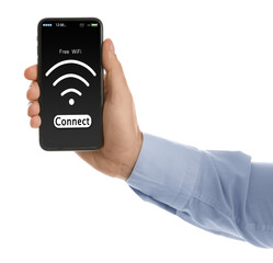 Man connecting to WiFi using mobile phone on white background, closeup