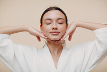 Young Woman Doing Face Building Yoga Facial Gymnastics Self Massage And Rejuvenating Exercises