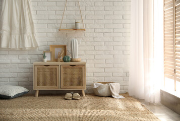 Poster - Stylish room interior with wooden cabinet near white brick wall