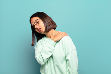 Canvas Print - young hispanic woman feeling tired, stressed, anxious, frustrated and depressed, suffering with back or neck pain