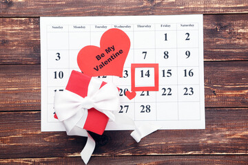 Canvas Print - February calendar with gift box and text Be My Valentine on wooden table