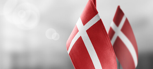 Wall Mural - Small national flags of the Denmark on a light blurry background