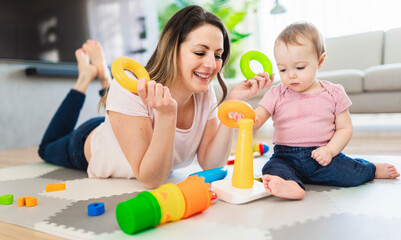 woman playing with her baby in the living room