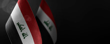 Small National Flags Of The Iraq On A Dark Background