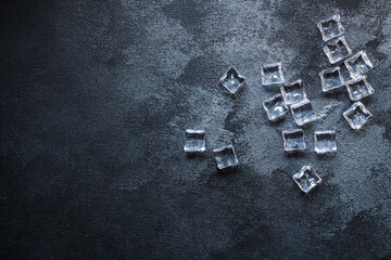 imitation artificial ice cubes plastic pieces transparent acrylic not really cold, optical illusion ready to eat on the table outdoor top view copy space for text food background