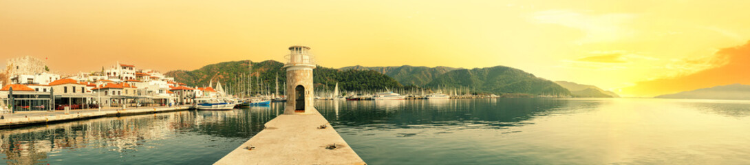 Wall Mural - old lighthouse in marmaris marina in evening