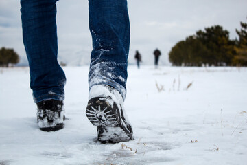 Wall Mural - man walks in the snow