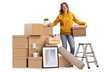 © Ljupco Smokovski - Young female with a pile of cardboard boxes packed for removal