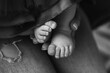 © 4 Your Eyes - Tiny baby feet of the firstborn in the loving arms of a young mother