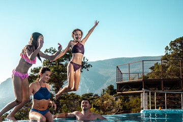 Happy Family, Daughter and father relaxing in the swimming pool together